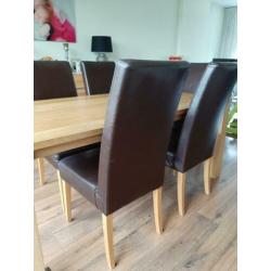 6 leren eetkamerstoelen met eikenhouten poten