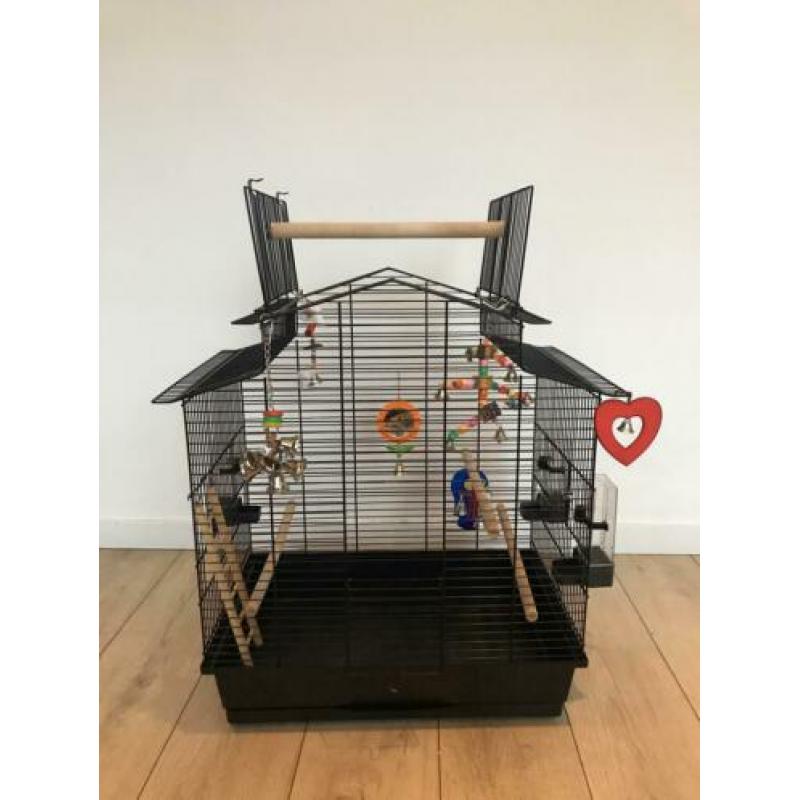 Vogelkooi en reiskooitje met toebehoren