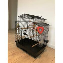 Vogelkooi en reiskooitje met toebehoren