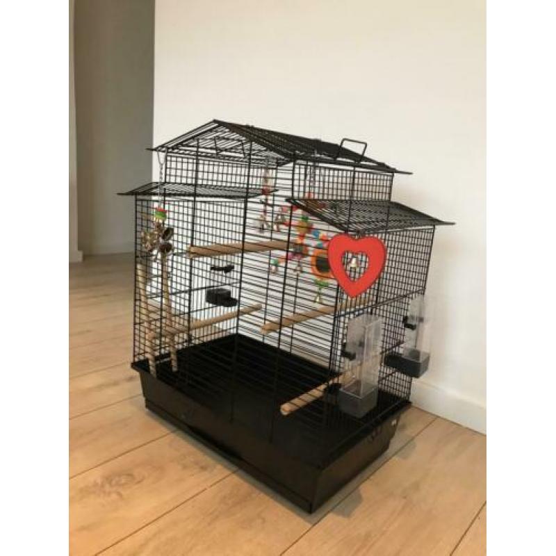 Vogelkooi en reiskooitje met toebehoren