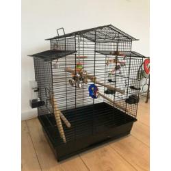 Vogelkooi en reiskooitje met toebehoren