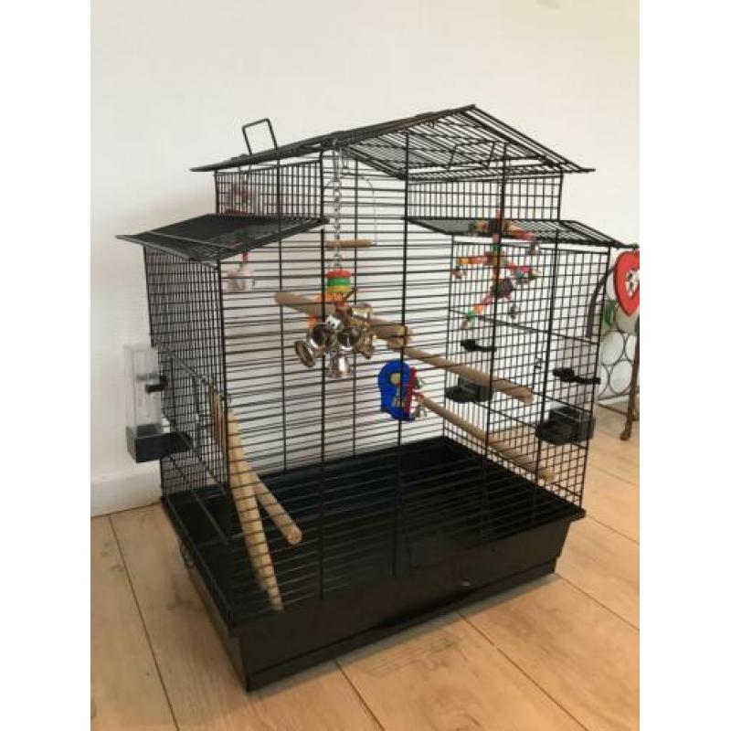 Vogelkooi en reiskooitje met toebehoren