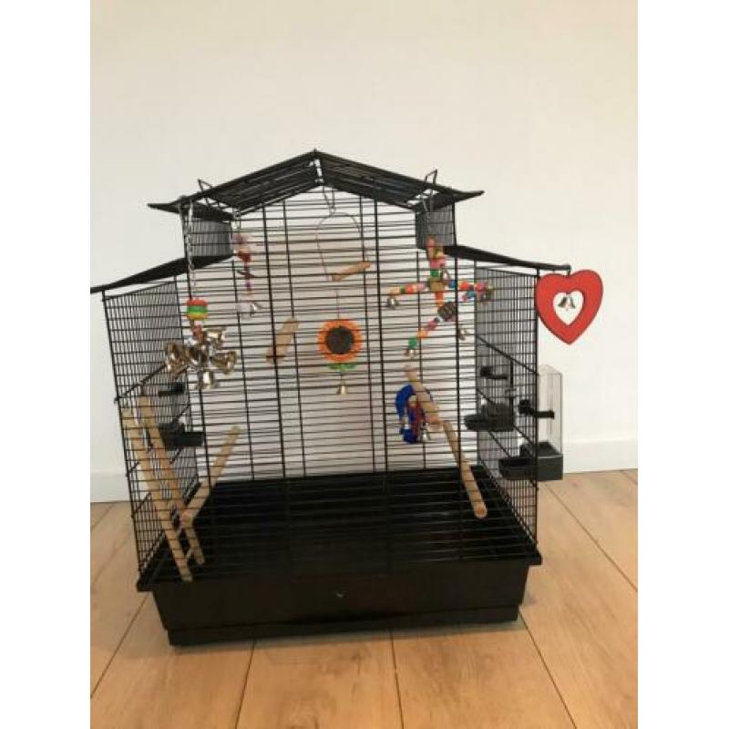 Vogelkooi en reiskooitje met toebehoren